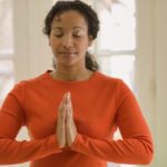 A woman praying during exercise