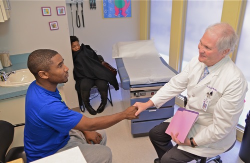 Dr. Morris at Church Health Center with patient