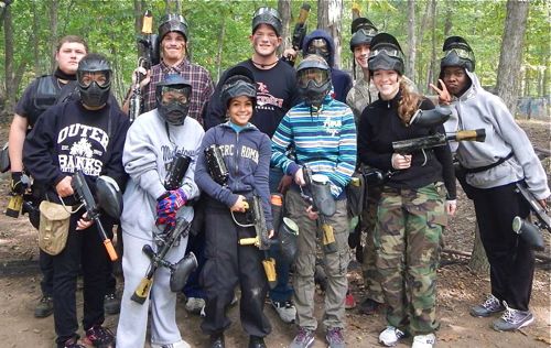 Jason's physical fitness helps him to do youth ministry like this paintball event.