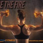 woman lifting dumbells that appear to be on fire.