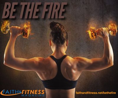 woman lifting dumbells that appear to be on fire.
