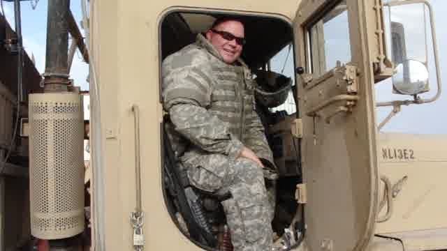 William Hansen in his truck in military service.